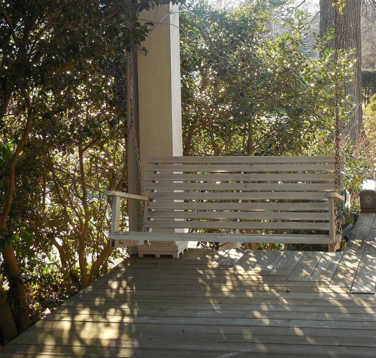 Wood porch column supporting a covered porch roof