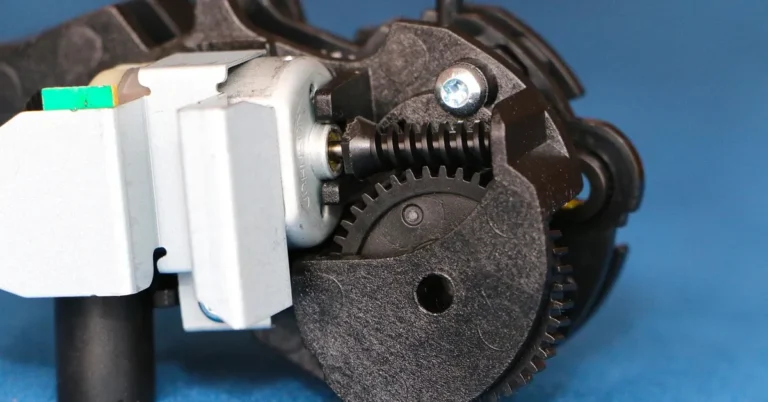 Worm gear mechanism showing a spiral worm meshing with a toothed gear wheel