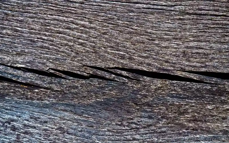 weathered wood board with a lengthwise split following the grain weathered wood board with a lengthwise split following the grain