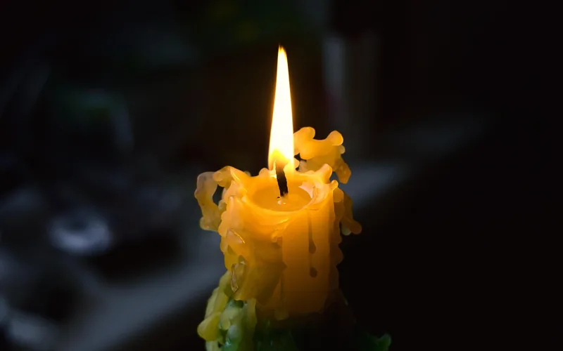 lit candle dripping wax, a common cause of wax stains on furniture lit candle dripping wax, a common cause of wax stains on furniture