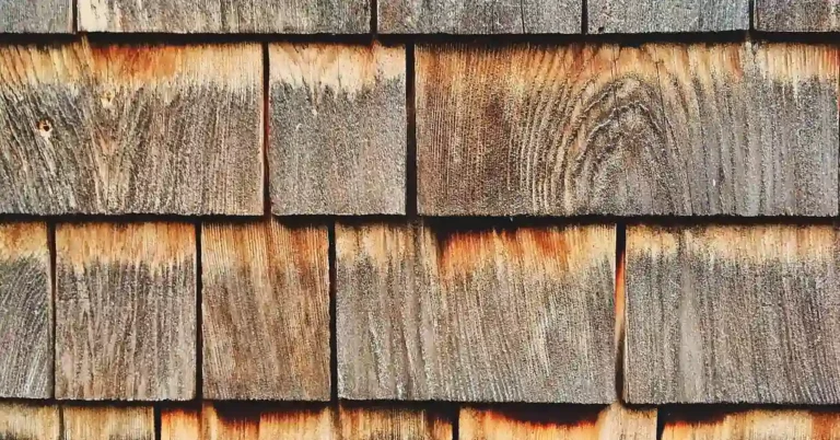stacked cedar wood planks showing natural grain and reddish tone