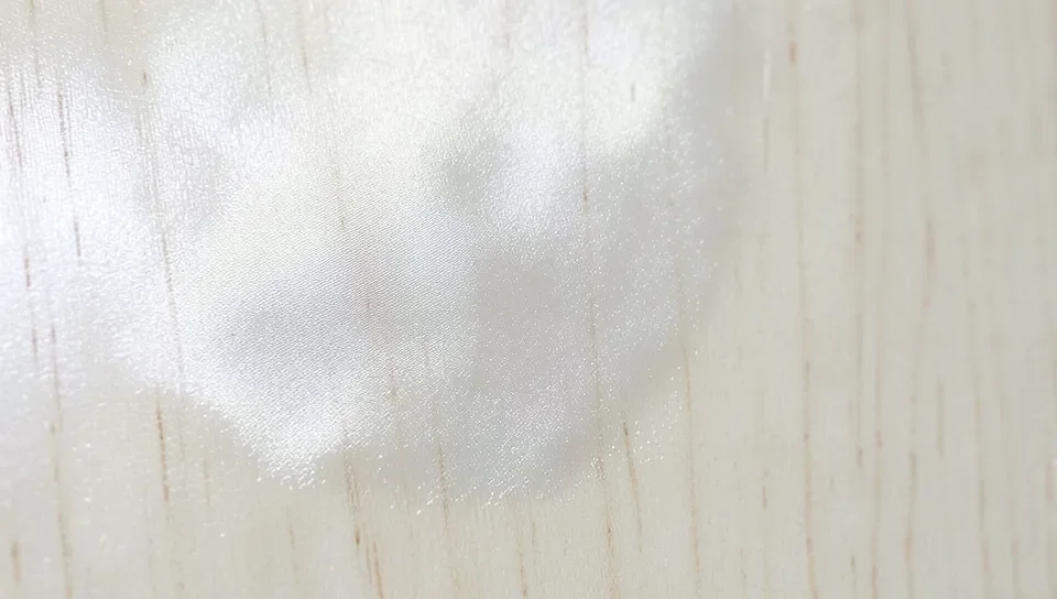 Clear water-based finish on light-colored wood
