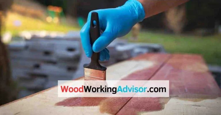 Applying gel stain to a wood board with a paintbrush