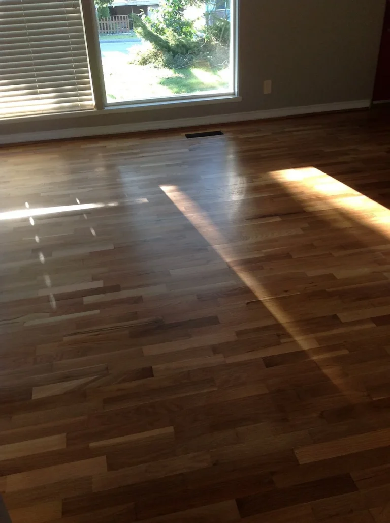 Glossy hardwood floor finished with multiple coats of polyurethane