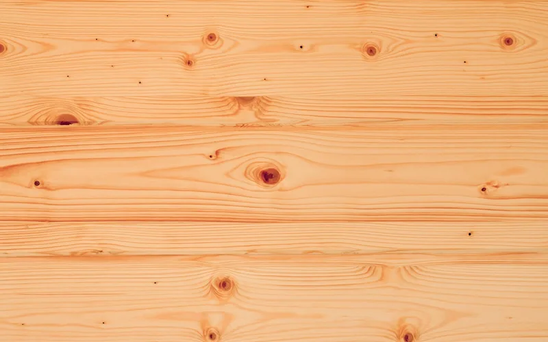 Knotty pine boards showing knots and grain