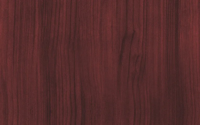 close-up of mahogany wood showing reddish-brown interlocked grain pattern