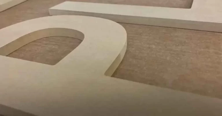 Close-up of MDF (medium-density fiberboard) showing its smooth, uniform composite structure