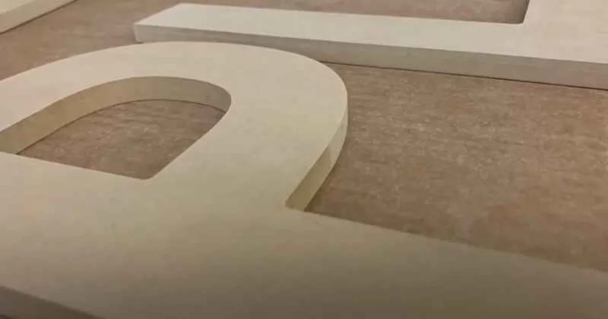 Close-up of MDF (medium-density fiberboard) showing its smooth, uniform composite structure