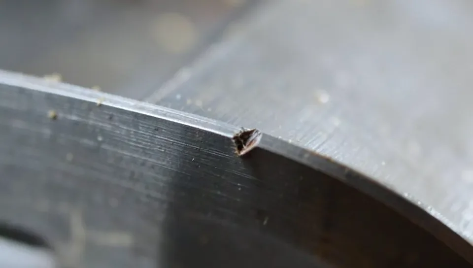 A small nick in a planer blade cutting edge