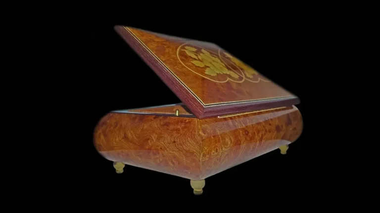 Polished burl wood jewelry box with swirling burl grain and a high-gloss finish