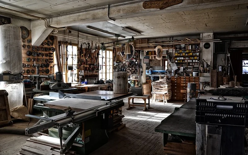 A woodworking shop interior with tools and lumber where a shop apron earns its keep