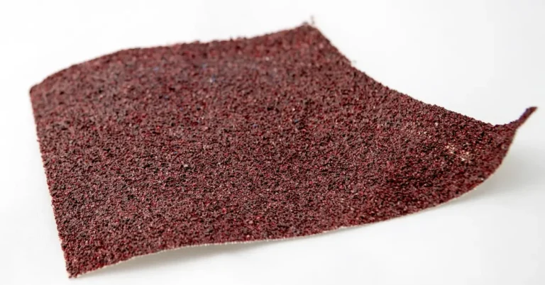 close-up of fine-grit sandpaper used for wet sanding the final coat of polyurethane