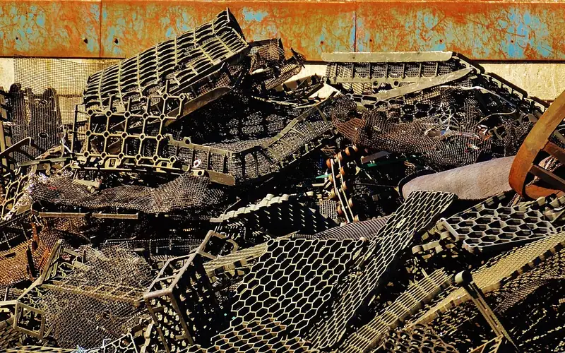 Scrap metal recycling yard with sorted metal piles