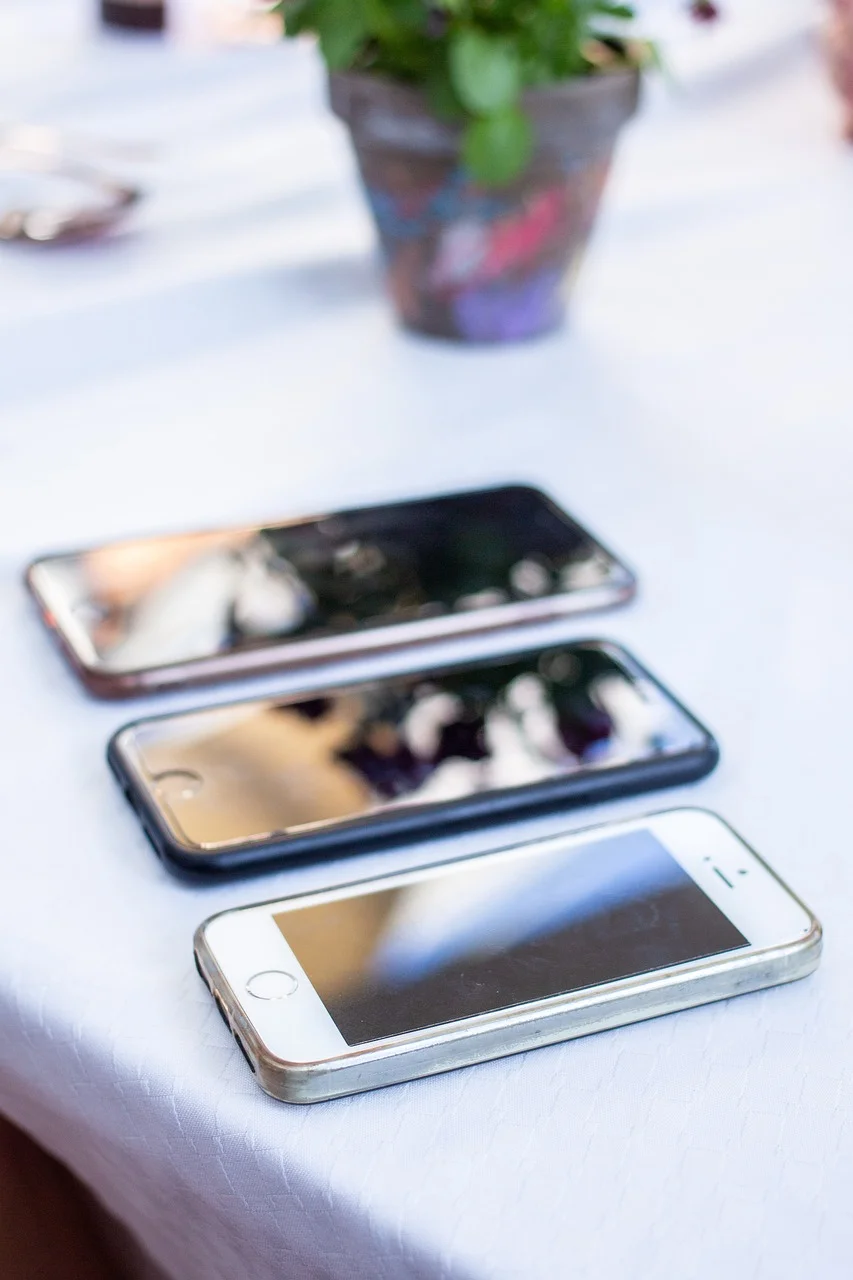 Three smartphones of different screen sizes lined up for comparison