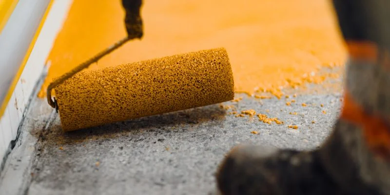 A thick, roller-applied resin floor coating, the kind of deep pour epoxy is made for, not polyurethane
