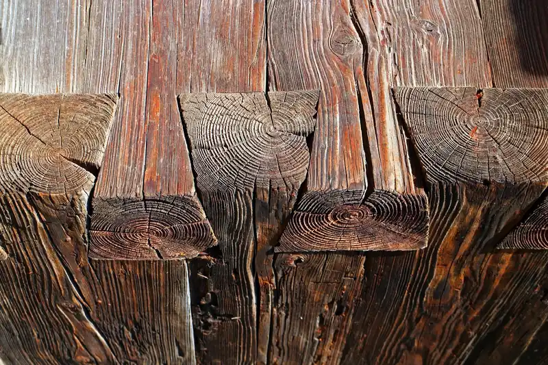 Weathered timber beams joined with square mortise and tenon corners
