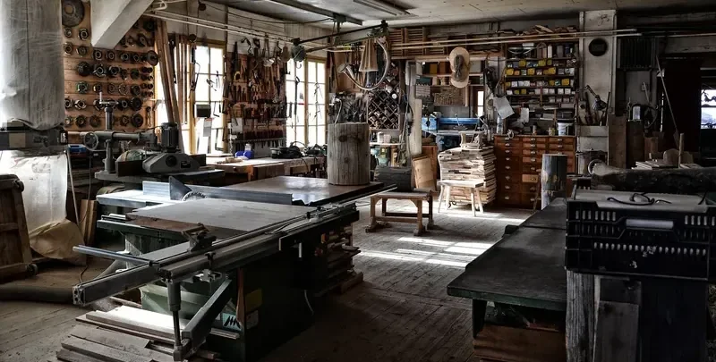 Traditional woodworking shop with table saw and hand tools