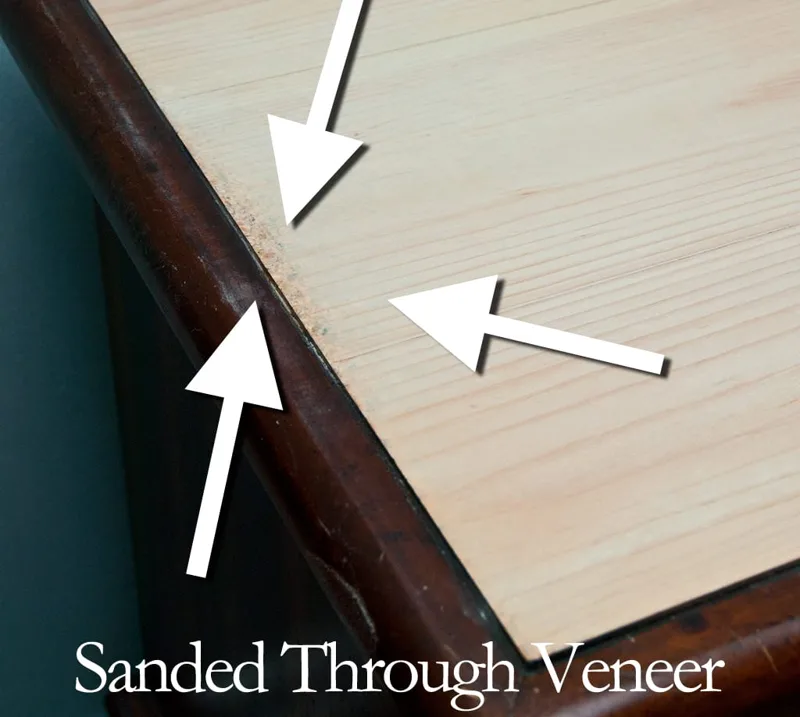 Example of a sand-through spot where sanding wore through the thin veneer face to the substrate underneath