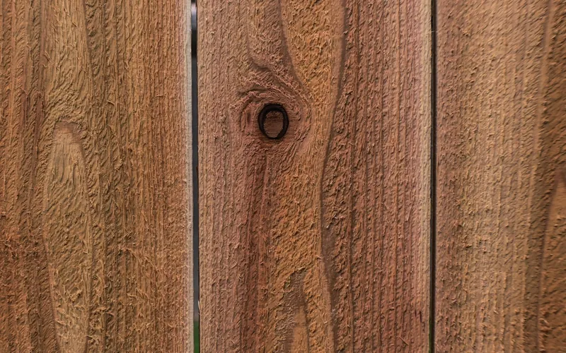 Cedar boards showing grain and a small tight knot