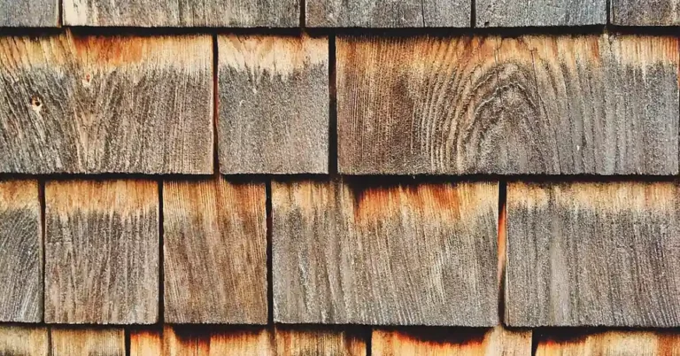 close-up of weathered cedar wood shingles showing natural wood grain and oils