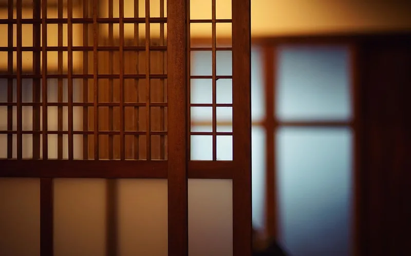 traditional wood lattice panel used as room divider in a Japanese-style interior