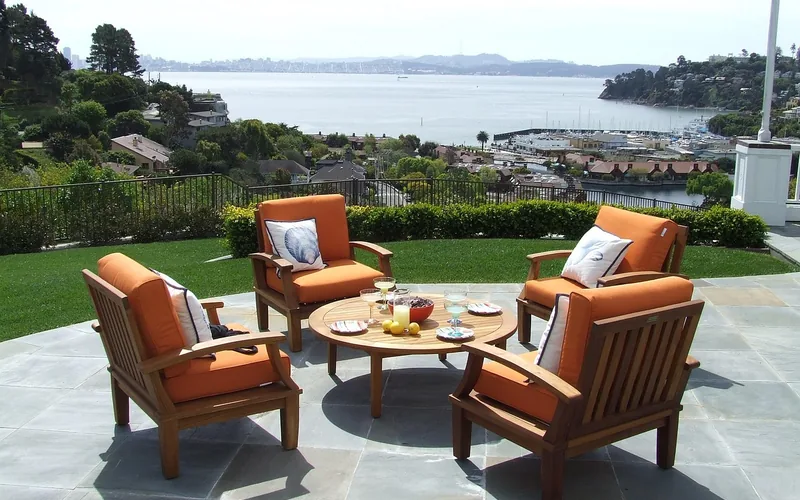 teak patio furniture set outdoors on a garden patio