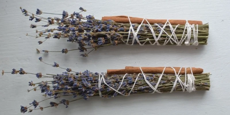 A dried herb bundle tied with natural twine - the same wrapping technique used for cedar
