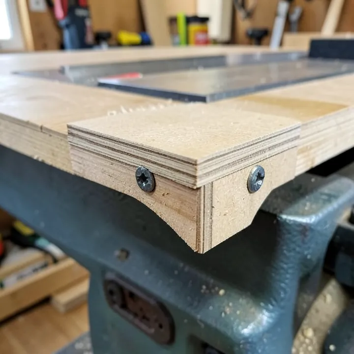 MDF table saw extension wing bolted flush to the cast iron table