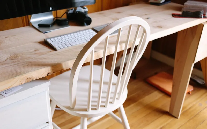 Hardwood desk setup with a monitor raised to eye level on a wooden riser Hardwood desk setup with a monitor raised to eye level on a wooden riser