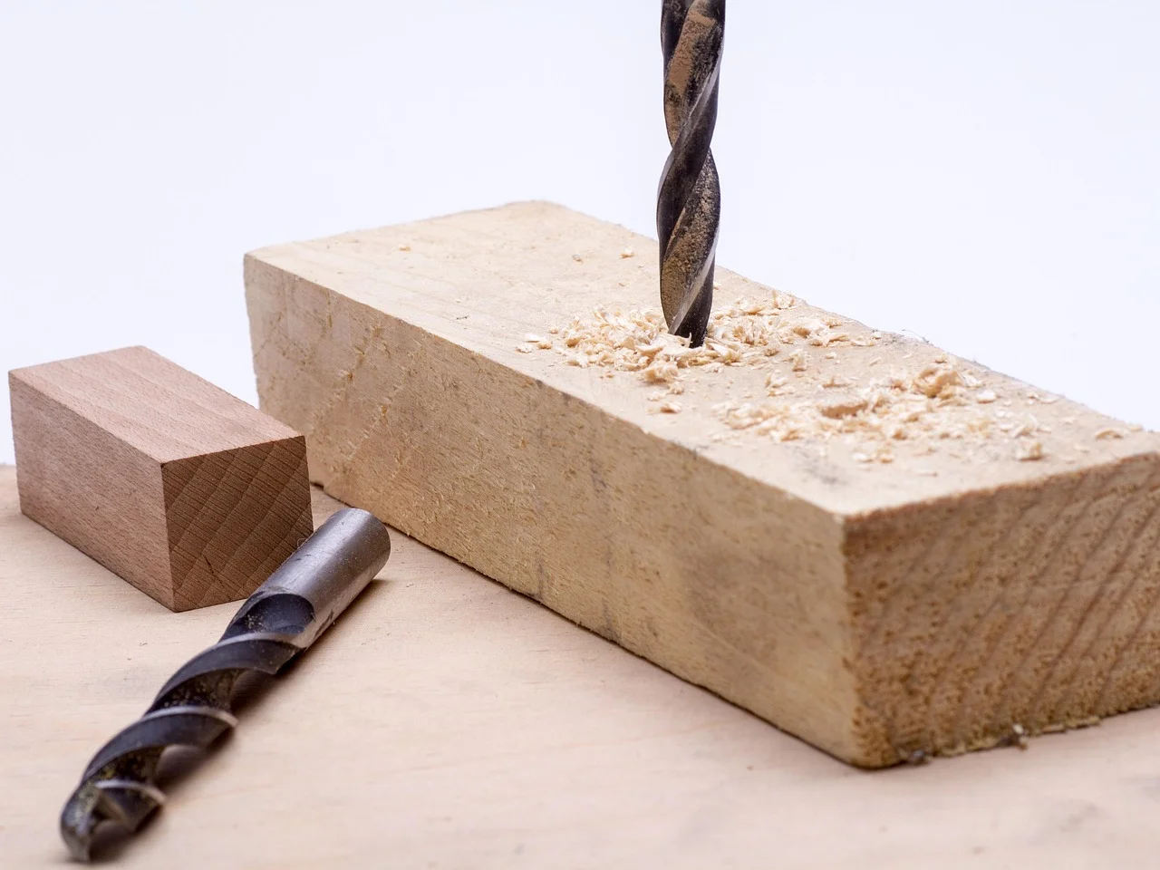 Drilling a pilot hole in plywood while building a shelf frame