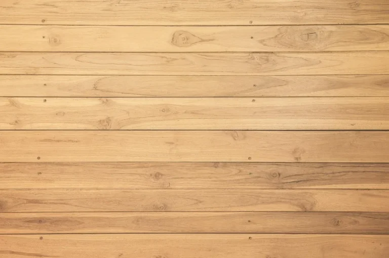 Horizontal light wood planks installed like a shiplap wall