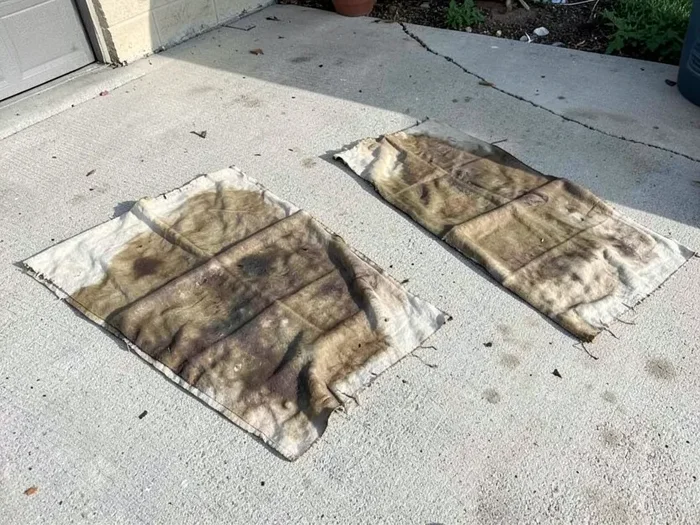 Linseed oil soaked rags laid flat and separated outdoors to dry safely and prevent spontaneous combustion