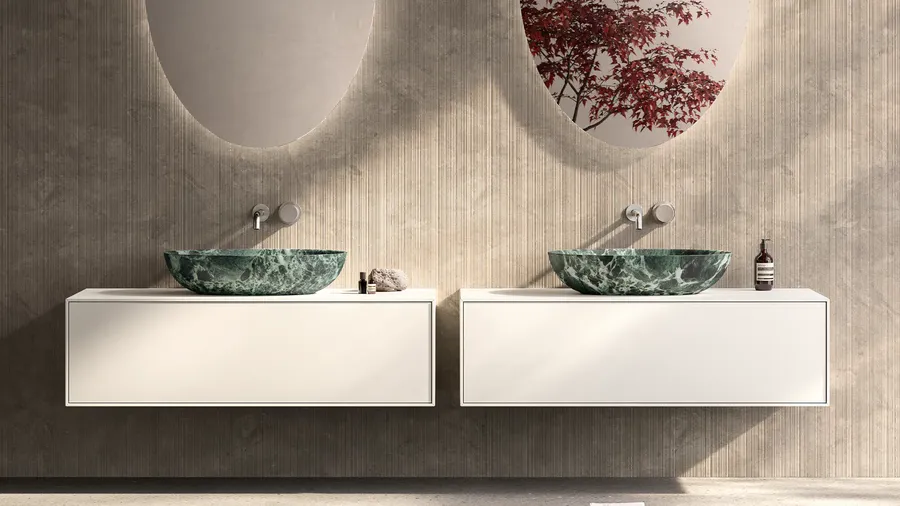 Modern bathroom vanity with a ribbed wood accent wall and stone vessel sinks