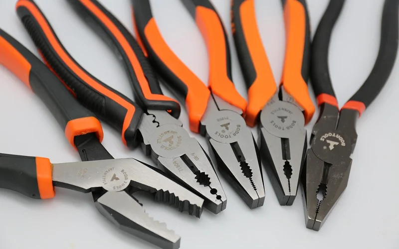 Needle-nose pliers next to a set of pliers, useful for gripping and pulling wood staples straight out