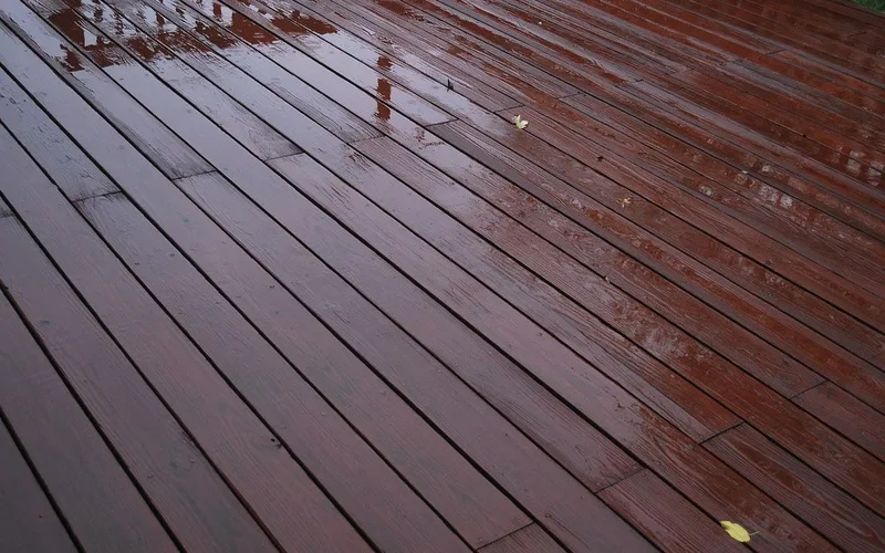 Rainwater beading on a sealed wooden deck