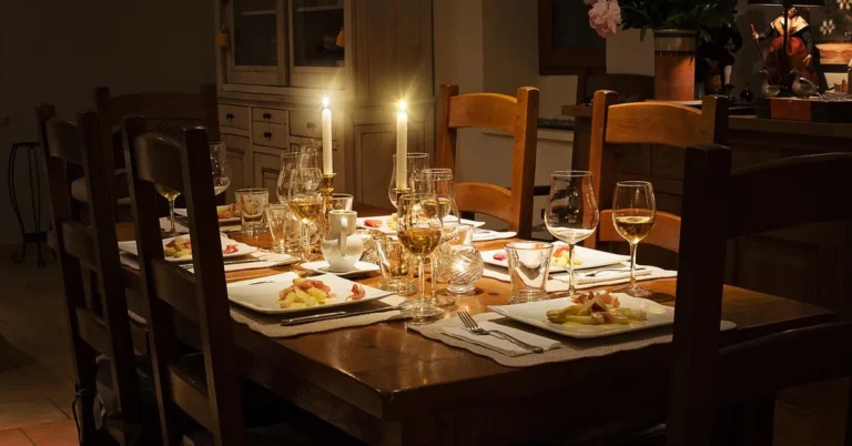elegant rectangular wood dining table set with candles for a dinner party