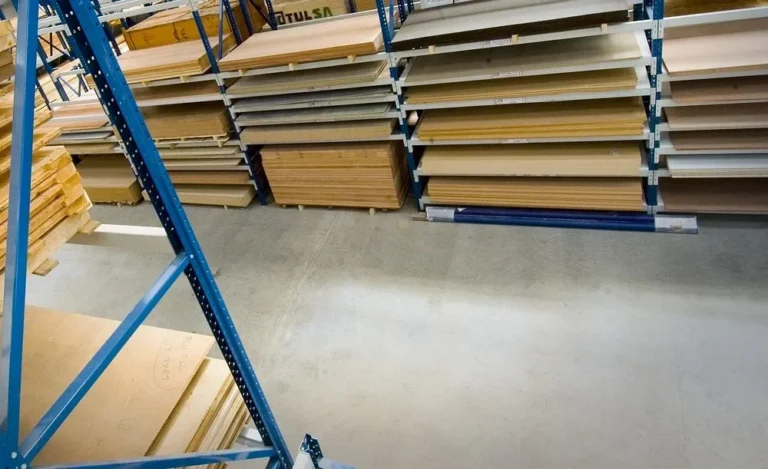 Plywood and sheet panels stacked on warehouse racks