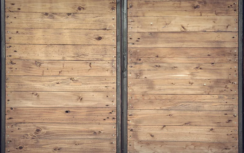 stacked softwood lumber boards showing visible knots and grain