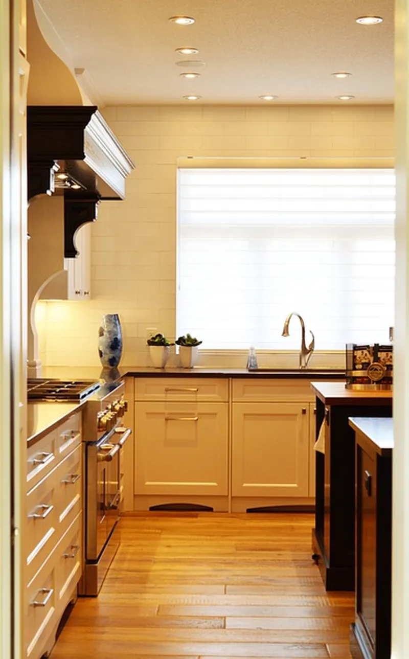 Modern wood kitchen with a central island, similar to a teak island focal point layout