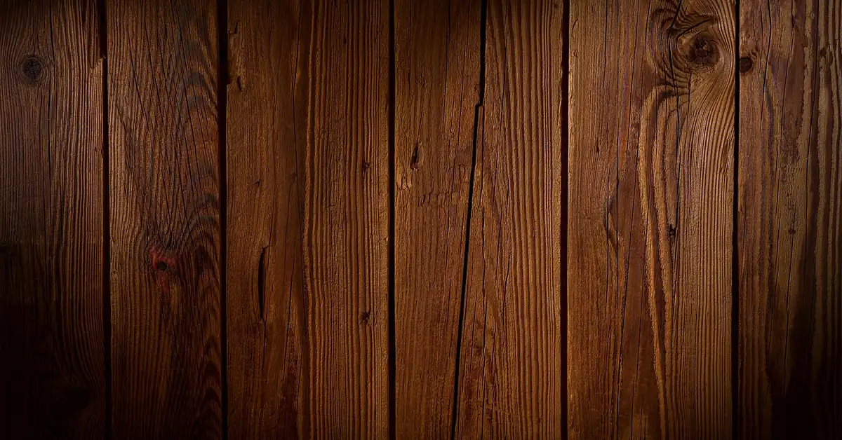 Warm brown wooden planks with natural knots and varied tone