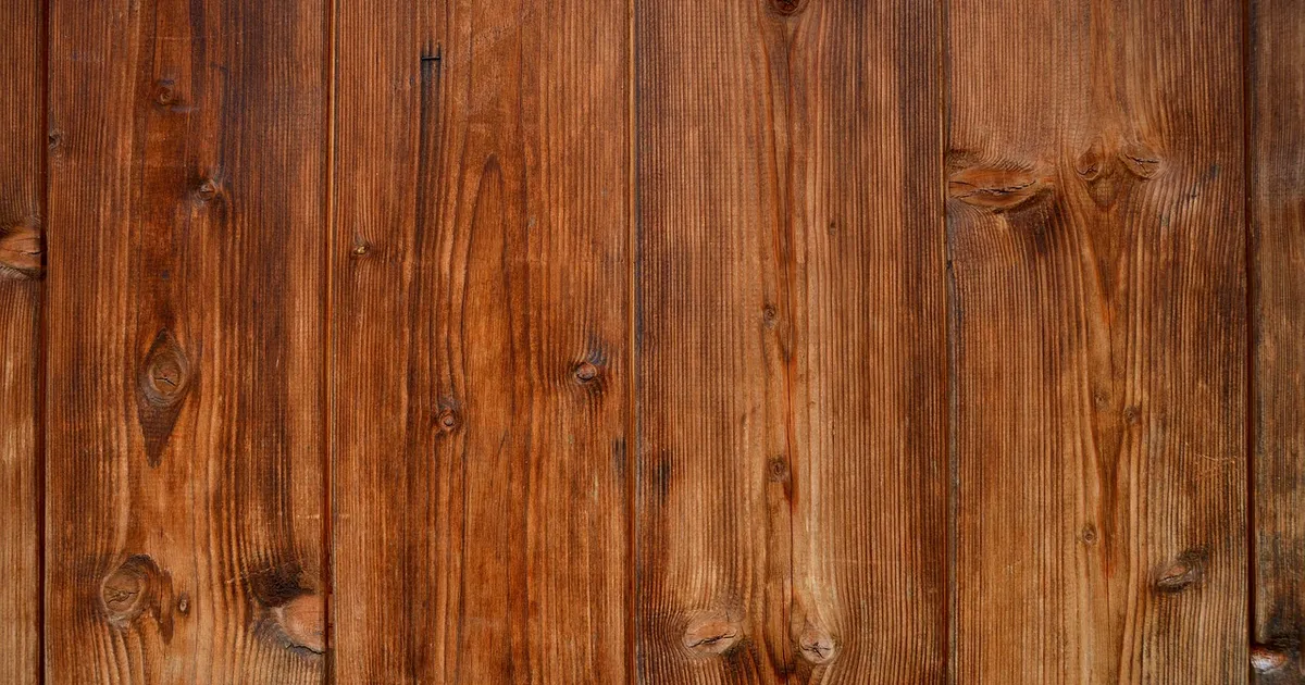 Warm brown wood planks with natural grain and knots