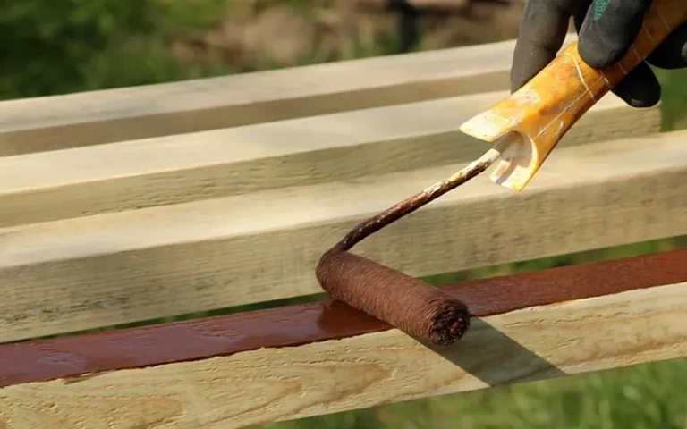 Applying wood finish with a roller after sanding off old primer
