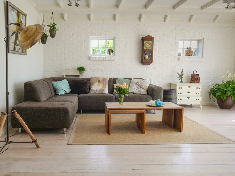 Light pine hardwood flooring installed in a cozy farmhouse-style living room