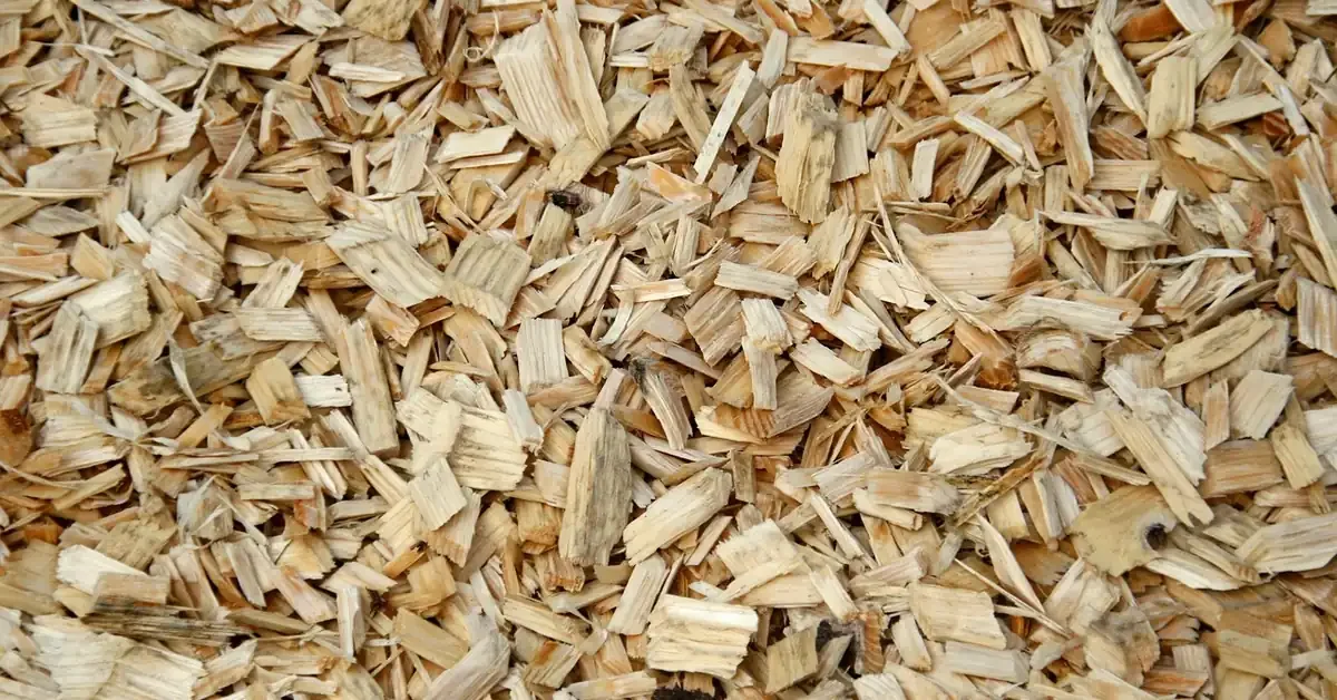 pile of wood chips, the raw material pressed into particle board