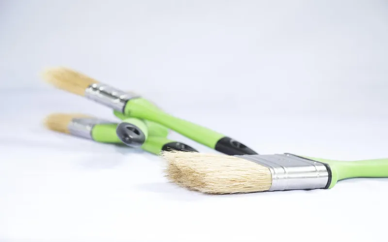 clean paintbrushes laid out ready for priming and painting an MDF project
