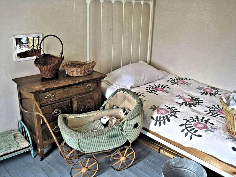 Antique wooden dresser with an aged finish in a period bedroom Antique wooden dresser with an aged finish in a period bedroom