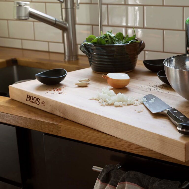 John Boos reversible maple wood cutting board on kitchen counter