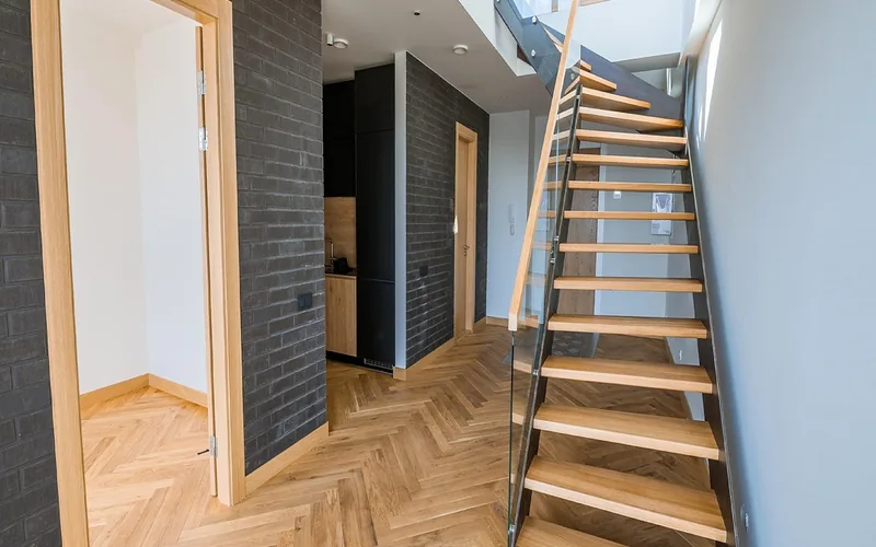 light-colored ash-style herringbone wood flooring in a modern hallway light-colored ash-style herringbone wood flooring in a modern hallway
