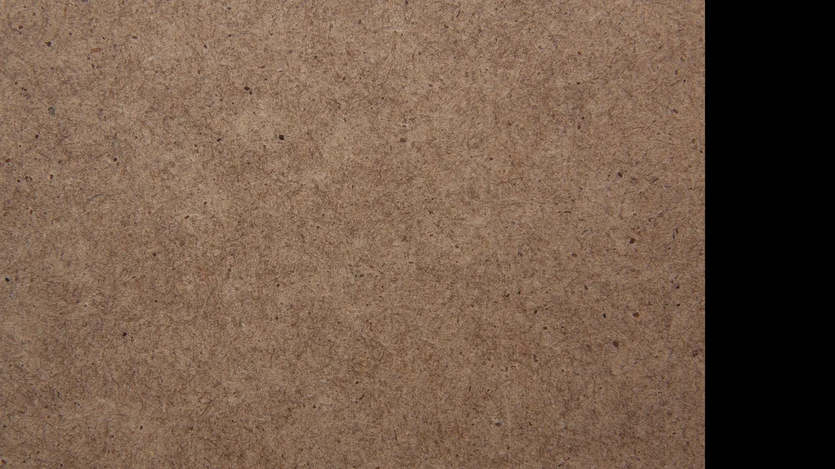 Smooth grain-free surface of a medium-density fiberboard panel