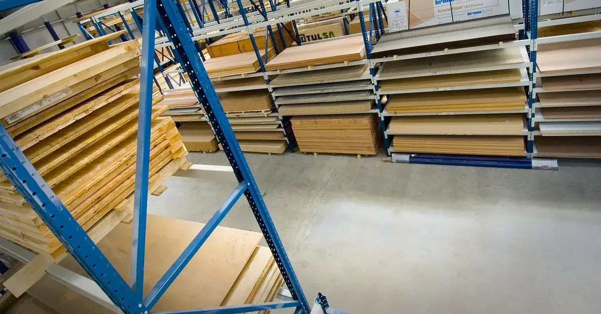 Stacks of MDF and particleboard sheets on warehouse racks